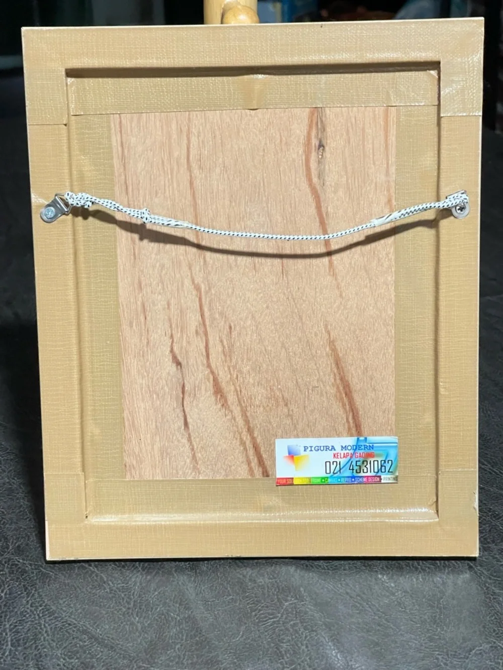 Framed postage stamps of children’s books. Frame soft yellow